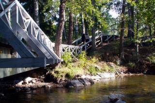 Women walking through a bridge.