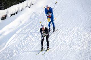 Two man are skiing in Korkeakangas
