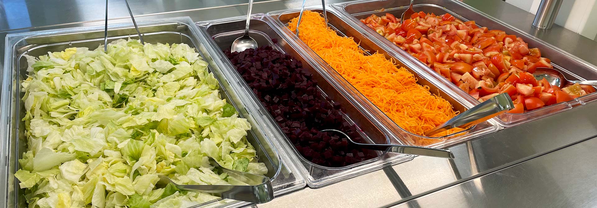 Salads in the school catering cart.