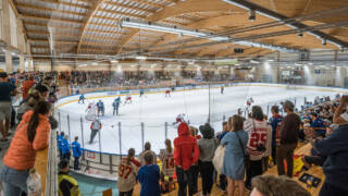 People watching an ice hockey game in the Valkeakoski ice rink Wareena.