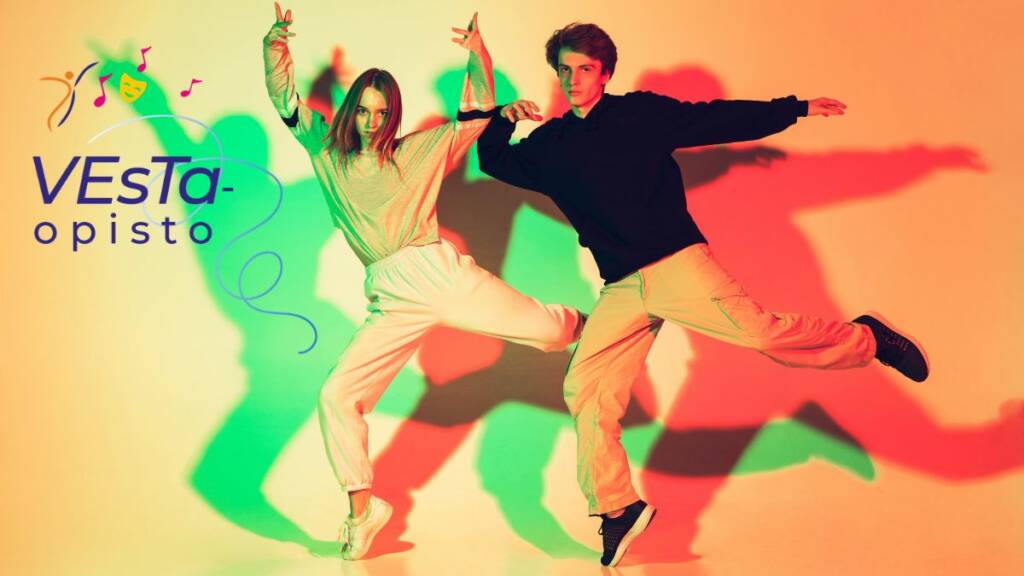 Vesta-opiston logon vieressä tyttö ja poika tanssivat.