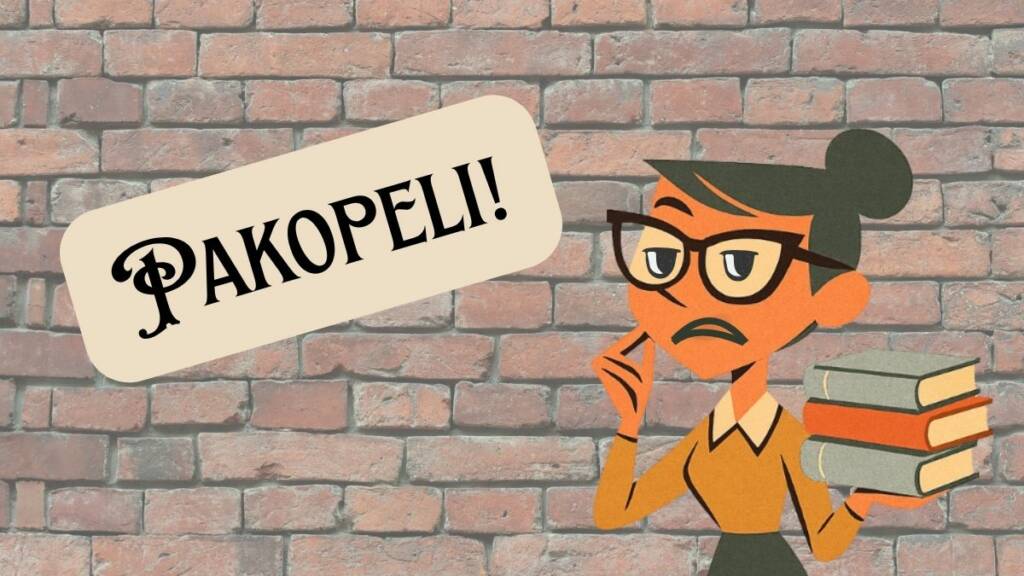 tiiliseinä, jonka edessä kirjastonhoitaja kirjoja kädessään