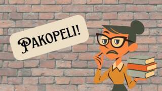 tiiliseinä, jonka edessä kirjastonhoitaja kirjoja kädessään