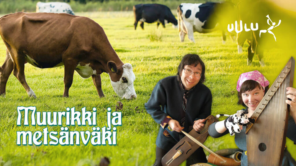 Mies ja nainen soittavat kanteleilla, ja heidän takanaan on lehmiä laitumella.